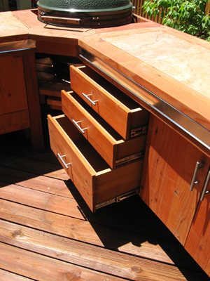 Plenty of storage space with drawers and doors in the Big Green Egg BBQ Station.